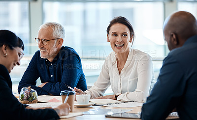 Buy stock photo Shot of a group of businesspeople during a boardroom meeting at work