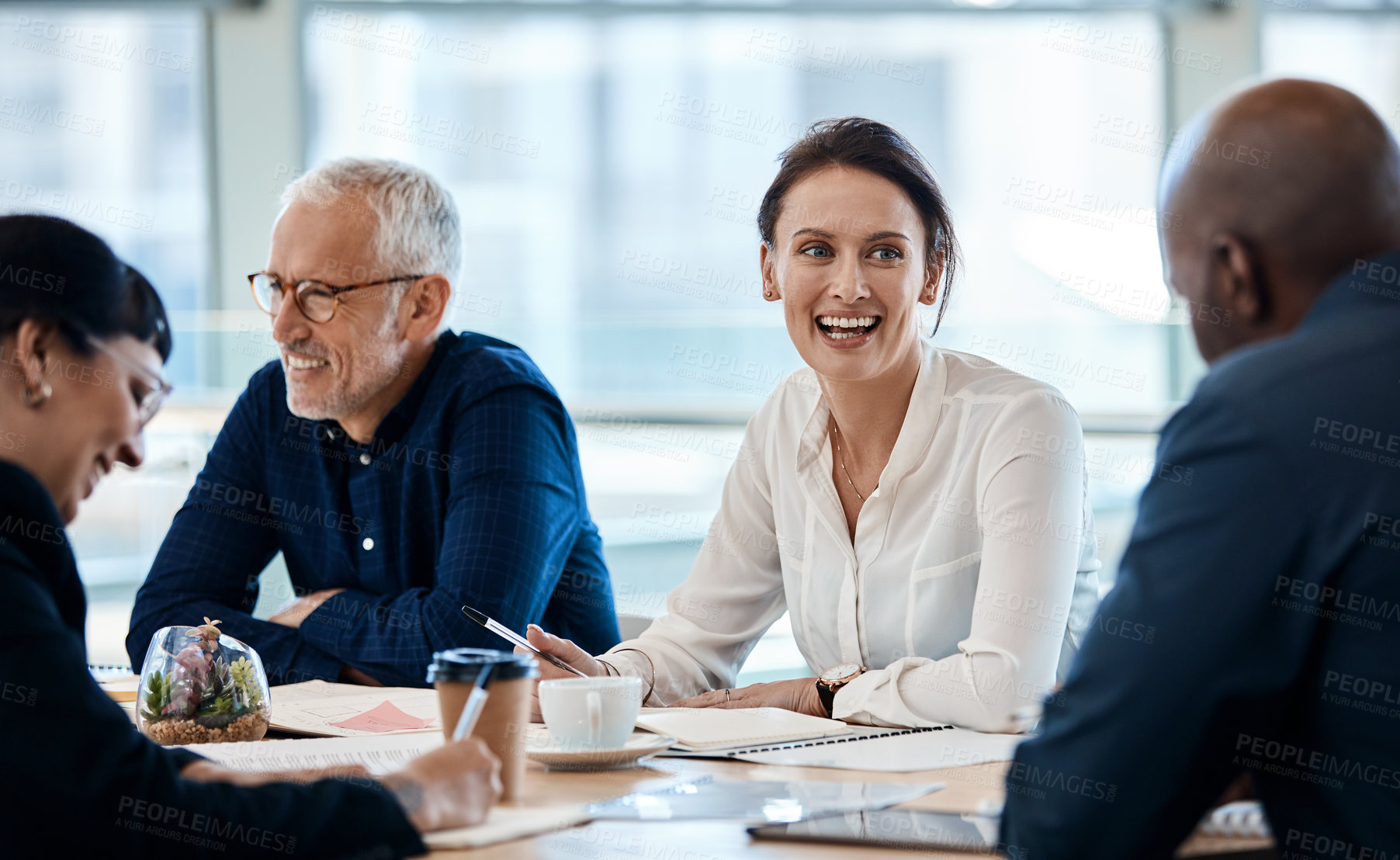 Buy stock photo Shot of a group of businesspeople during a boardroom meeting at work