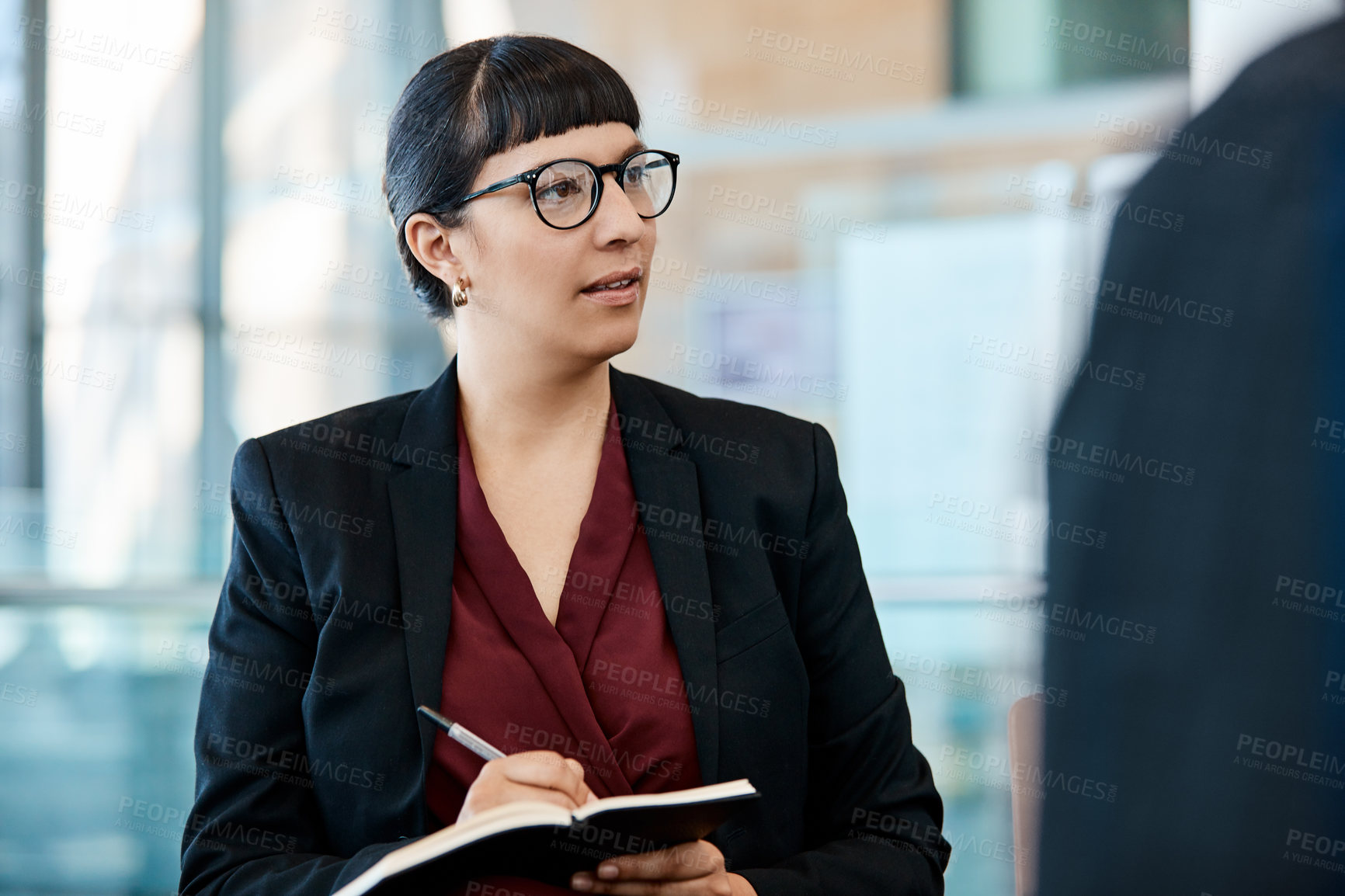 Buy stock photo Listen, woman and notes in meeting in office for local market trends, buyer matching or referrals. Staff, realtor and notebook in discussion for property insight, negotiation tactics and client leads