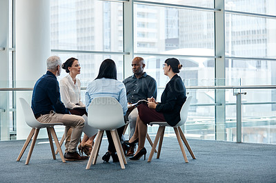 Buy stock photo Full length shot of a group of businesspeople during a meeting at work