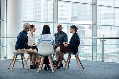 Buy stock photo Full length shot of a group of businesspeople during a meeting at work