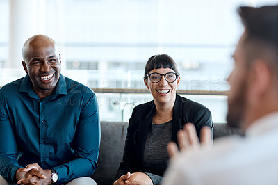 Buy stock photo Shot of a group of businesspeople having a meeting together at work