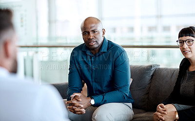 Buy stock photo Shot of a group of businesspeople having a meeting together at work
