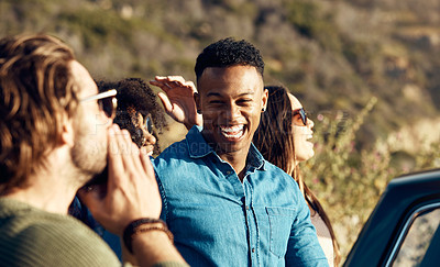 Buy stock photo Cropped shot of a diverse young group of friends socialising together on the beach during a road trip