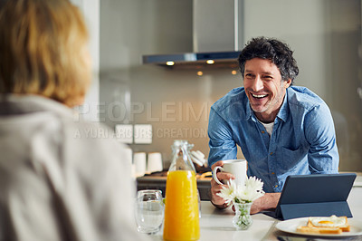 Buy stock photo Shot of a mature couple having breakfast together at home