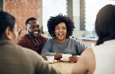 Buy stock photo Cropped shot of a young diverse group of friends sitting together and enjoying coffee in a cafe during the day