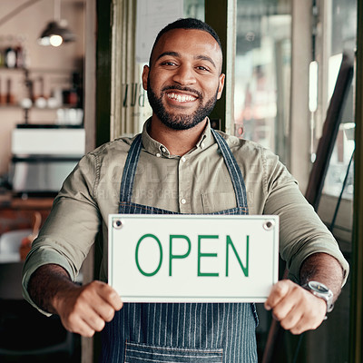 Buy stock photo Portrait of a young man holding an 