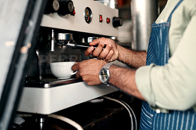 Buy stock photo Closeup shot of a barista preparing coffee in a cafe