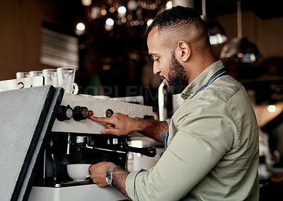 Buy stock photo Shot of a barista preparing coffee in a cafe