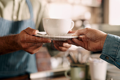 Buy stock photo Shot of an unrecognisable man serving coffee to a customer in a cafe