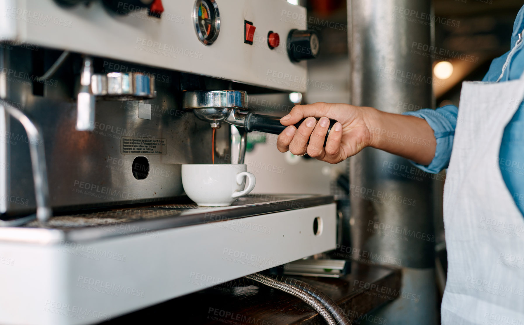 Buy stock photo Closeup shot of a barista preparing coffee in a cafe