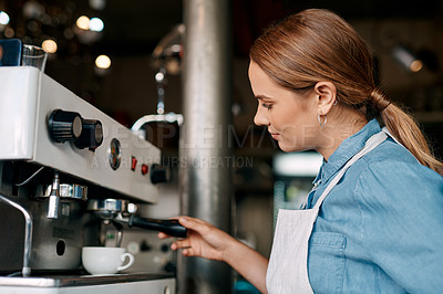 Buy stock photo Shot of a barista preparing coffee in a cafe