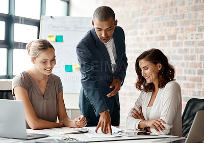 Buy stock photo Shot of a diverse group of businesspeople having a meeting in the office during the day