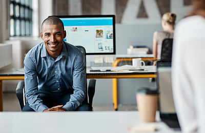 Buy stock photo Portrait of a confident young businessman working in an office