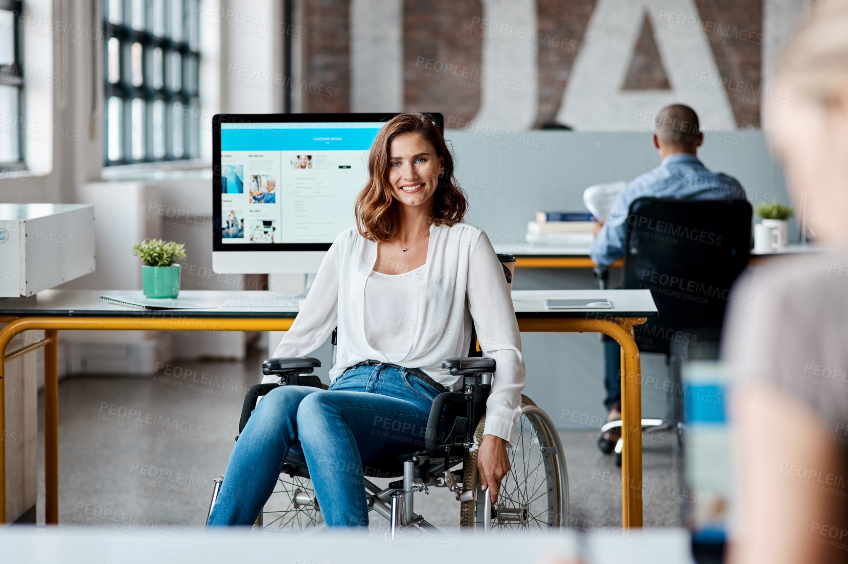 Buy stock photo Portrait of a young businesswoman in a wheelchair working in an office