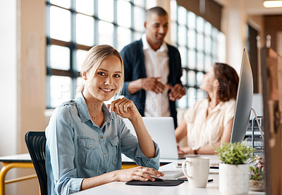 Buy stock photo Portrait of a young businesswoman working on a computer in an office