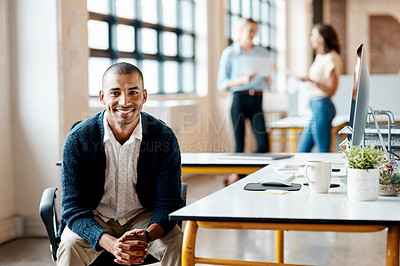 Buy stock photo Portrait of a confident young businessman working in an office