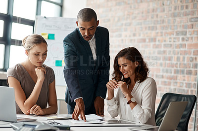 Buy stock photo Shot of a group of businesspeople having a meeting in an office