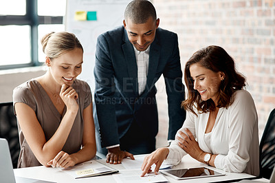 Buy stock photo Shot of a group of businesspeople having a meeting in an office