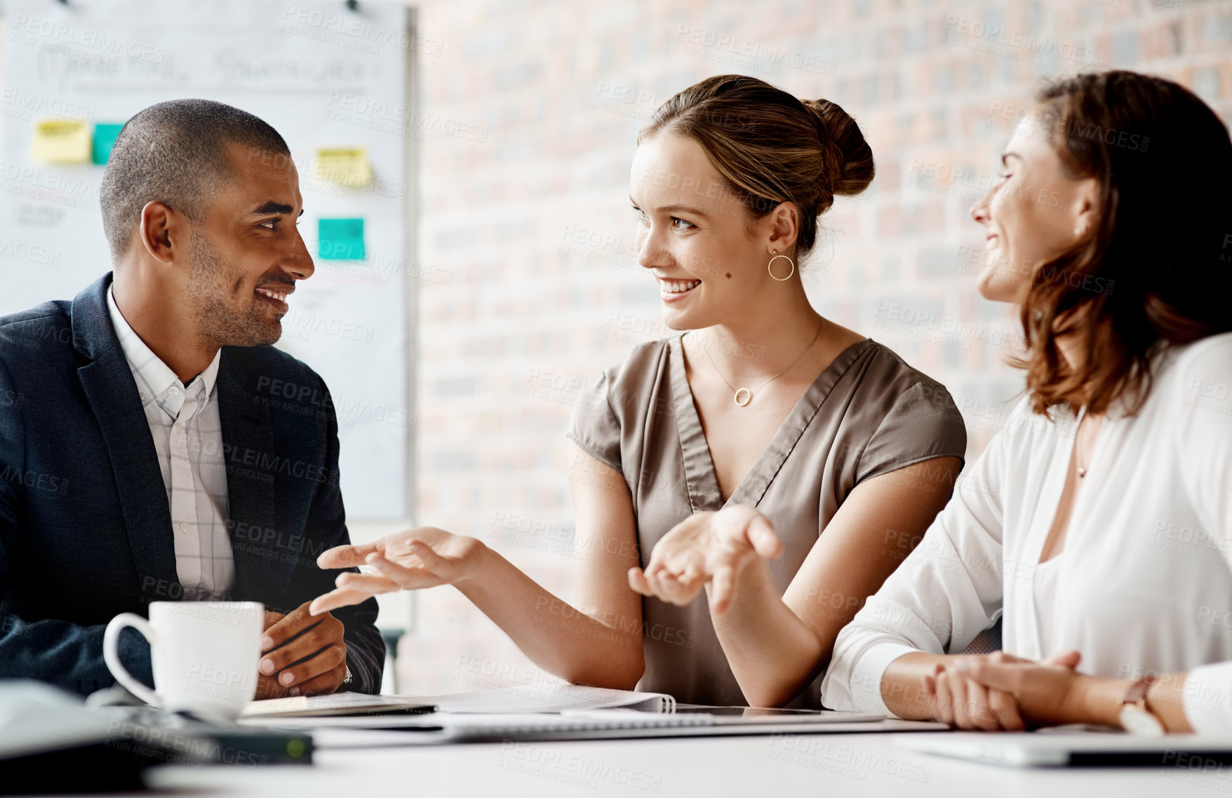 Buy stock photo Shot of a group of businesspeople having a meeting in an office