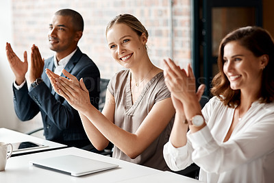 Buy stock photo Shot of a group of businesspeople applauding during a meeting in an office