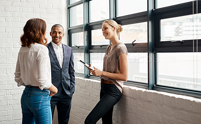 Buy stock photo Shot of a group of businesspeople having a discussion in an office