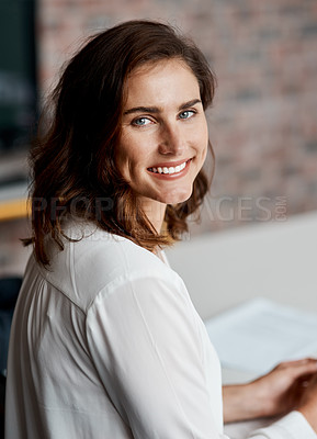 Buy stock photo Portrait of a young businesswoman sitting in an office