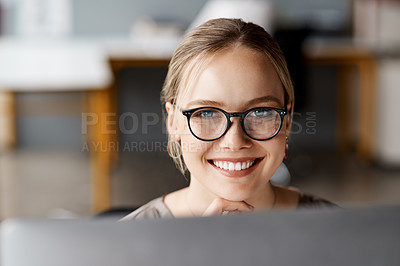 Buy stock photo Portrait of a young businesswoman using a computer in a modern office