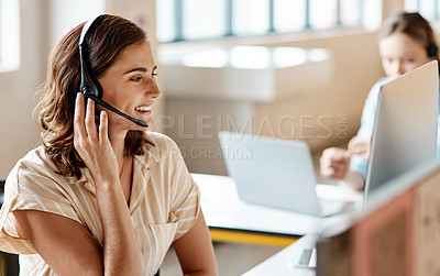 Buy stock photo Shot of a young woman using a headset in a modern office