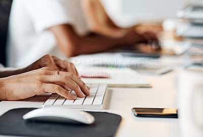 Buy stock photo Shot of an unrecognisable businesswoman using a computer in a modern office
