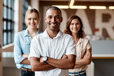 Buy stock photo Portrait of a group of confident young businesspeople working together in a modern office