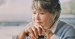 Thinking, serious and senior woman in home with nostalgia, perspective and reflection in living room. Walking stick, space and elderly person in house with remember, memory or decision on retirement.