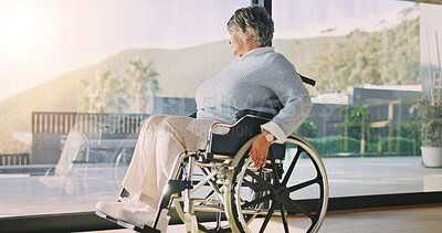 Buy stock photo Wheelchair, retirement and woman by window, thinking or nostalgia with perspective in living room. Thoughts, reflection or senior person with disability, past memory or flashback with view at home