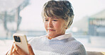 Phone, relax and senior woman in home with texting, email or communication on mobile app. Calm, retirement and elderly person with cellphone for contact, research or reading blog on website in house.