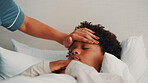 Forehead, hand and mom with sick child on bed, health check and monitoring body temperature in house. Childcare, parent and person with empathy for kid, support and boy with flu symptoms in bedroom