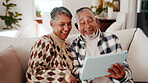 Senior couple, reading and laughing with tablet in lounge, connection or article on social media app. Retirement, home and happy people with technology in living room, entertainment and funny news