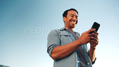 Buy stock photo Laughing, online or man with phone, outdoor and planning for campaign or brand awareness on website. Digital marketing, social media manager or happy person with tech for info, low angle or sky space