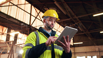 Buy stock photo Serious, architect and man with tablet on construction site, online or plan for property development. Civil engineer, low angle and person with tech, typing and building renovation research on web