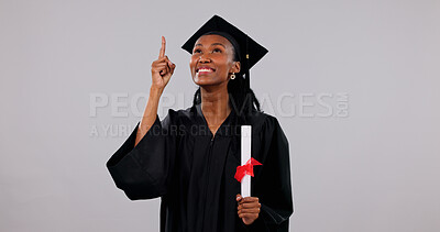 Buy stock photo Diploma, graduation and pointing with black woman in studio for education announcement or information. Learning, space and university sign up with happy student on white background for scholarship