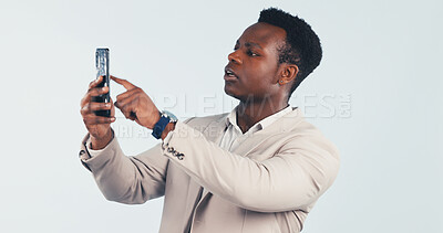 Buy stock photo Phone, connection and black man with bad signal in studio for network error on a white background. Frustrated, male person or lost reception with mobile smartphone for poor internet or wrong app