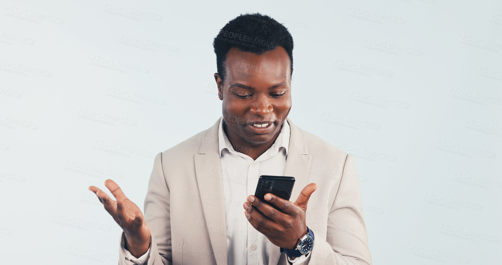 Buy stock photo Businessman, surprise and smile in studio with phone, reading email or good news for budget proposal. Happy, black man and shock with tech, text message and positive feedback on white background.