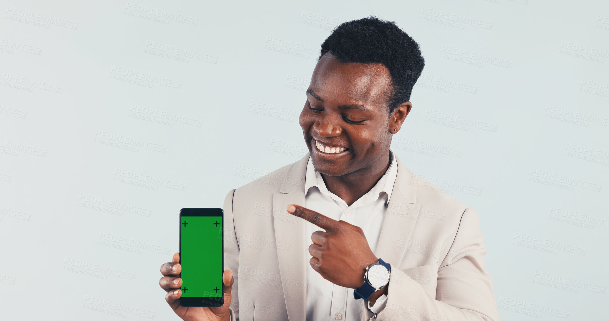 Buy stock photo Businessman, phone or pointing with green screen in studio for advertising on a white background. Black man, employee or showing smartphone display with smile for marketing mobile app on mockup space