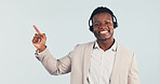 Portrait, consultant and black man pointing in studio for online advice on a white background. Happy, businessman or agent with smile, headset or tips for virtual assistance, help or CRM on space