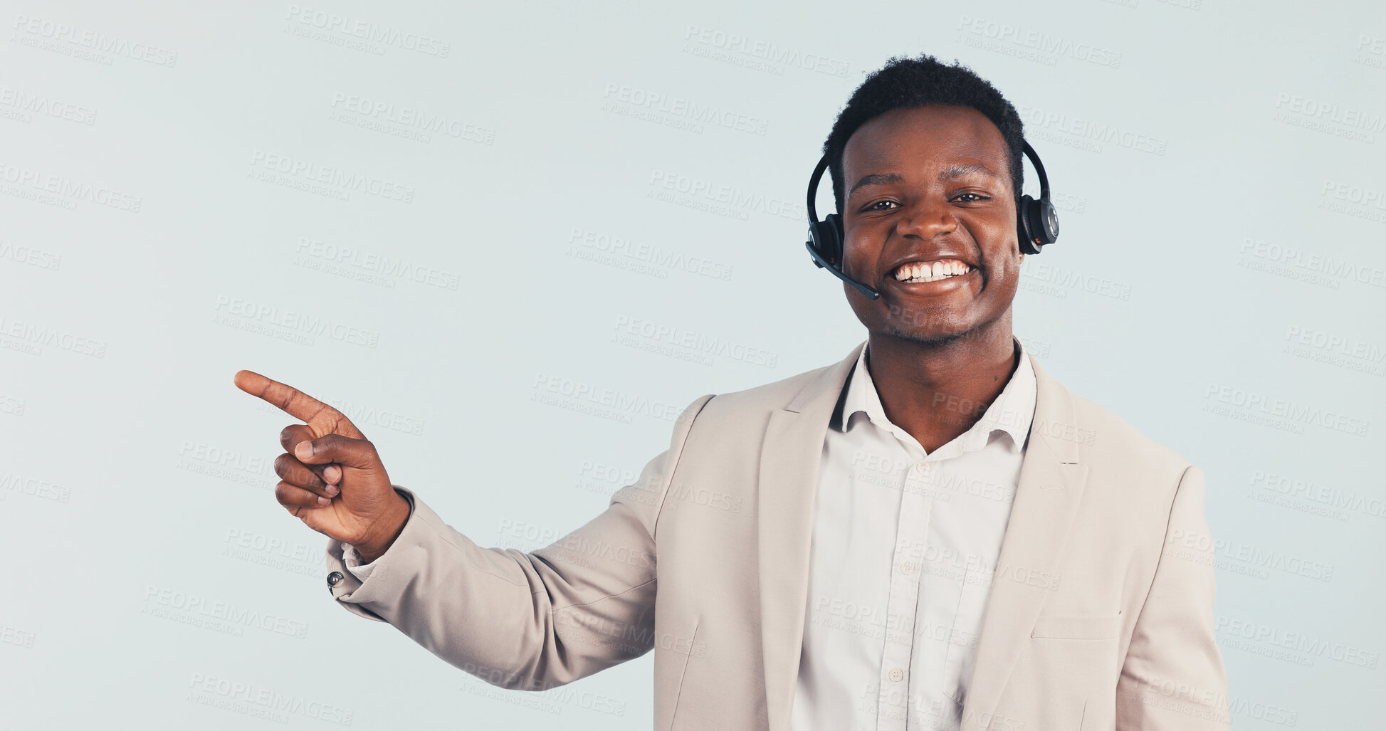 Buy stock photo Portrait, consultant or black man pointing in studio with headset for CRM advice on a white background. Male person, happy agent or customer service with smile for virtual assistance or help on space