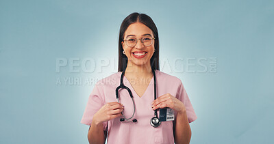 Buy stock photo Stethoscope, woman and nurse in studio for healthcare, space and heart health on blue background. Happy female person, medical worker and professional with cardiology equipment, pride or portrait