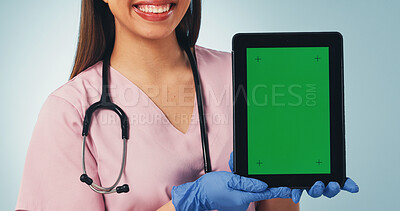 Buy stock photo Nurse, hands and happy woman with tablet green screen for advertising on a blue studio background. Female person, healthcare worker or smile with technology display for UI, UX or app on mockup space