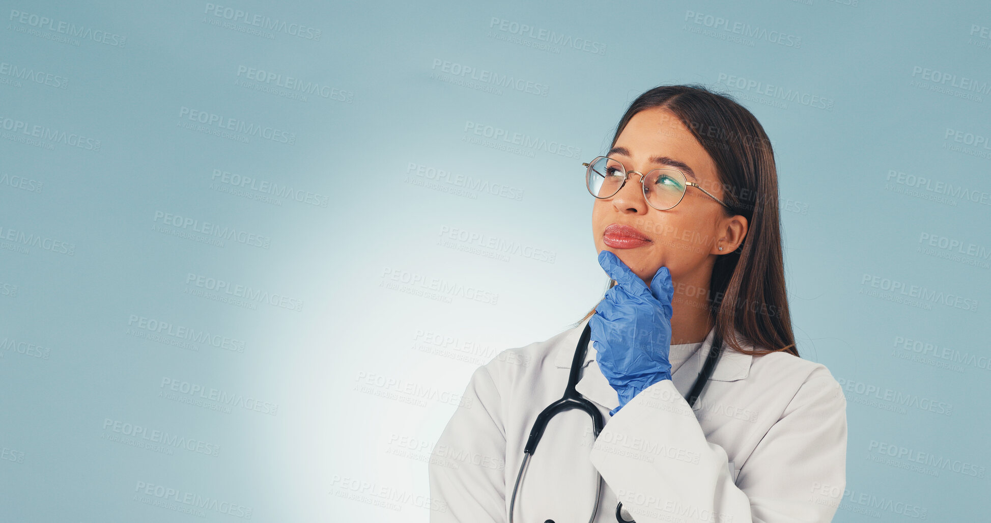 Buy stock photo Doctor, woman and thinking in studio with vision, mockup space and perspective for medical decision. Gynecologist, person and reflection for healthcare, problem solving and idea on blue background.