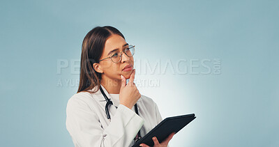 Buy stock photo Doctor, woman and thinking in studio with tablet, medical research and planning for diagnosis decision. Healthcare worker, person and reflection with tech, problem solving or space on blue background