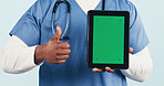 Nurse, tablet and thumbs up with green screen for advertising on a studio background. Person, healthcare worker or technology display with like emoji or yes sign for UI, UX or Telehealth app review