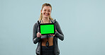 Woman, portrait and tablet green screen in studio for advertising, gym app or technology. Info, display or person with fitness website, mockup space and happy with online announcement on background